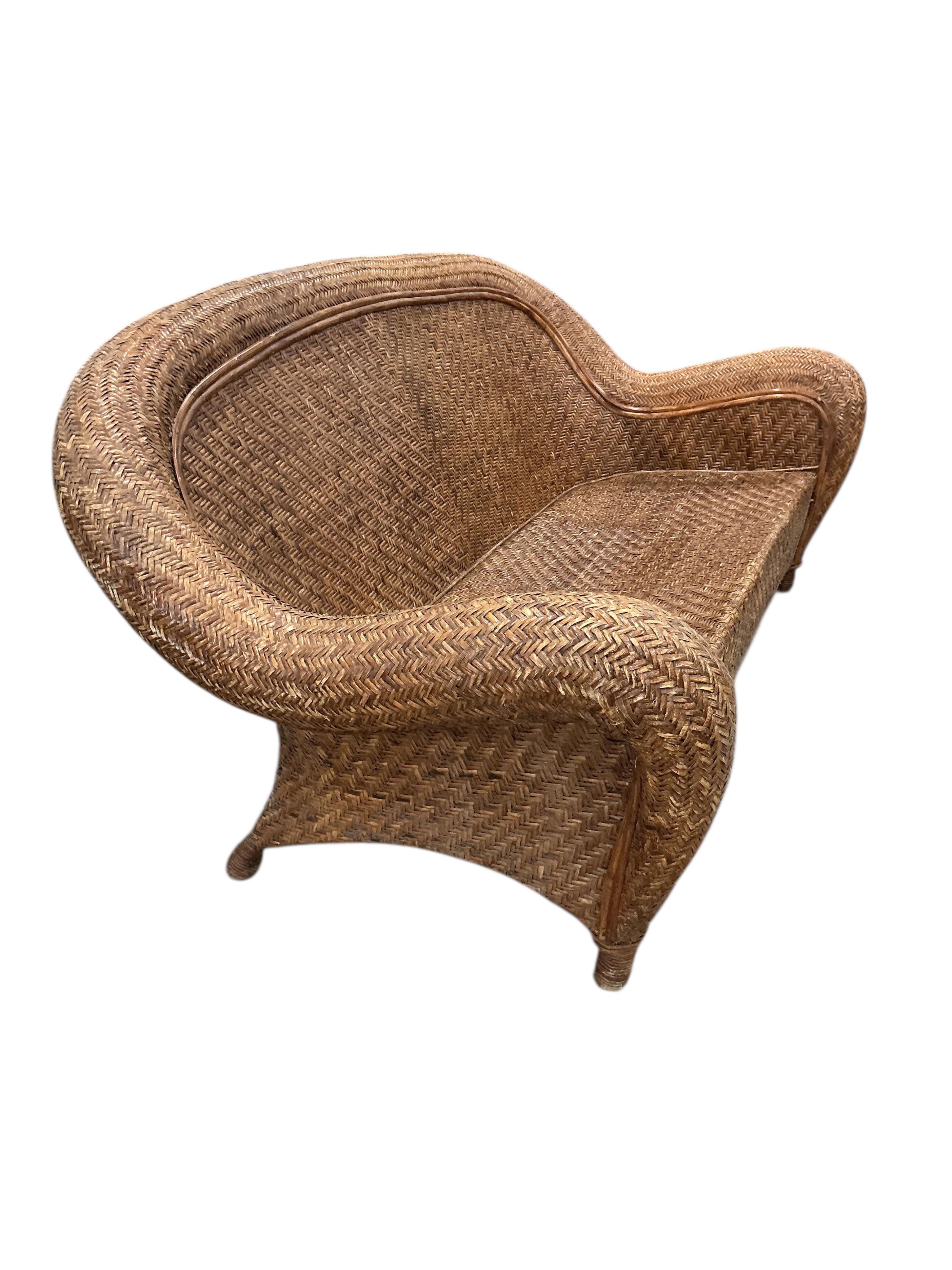 A rattan conservatory settee with associated cushion seat and back, width 186cm, depth 94cm, height 86cm